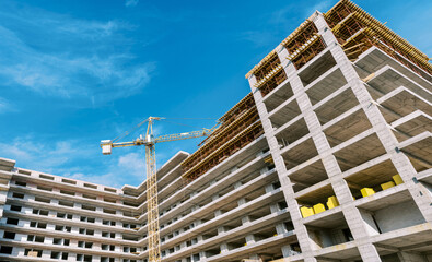 Tower crane builds a high-rise residential complex