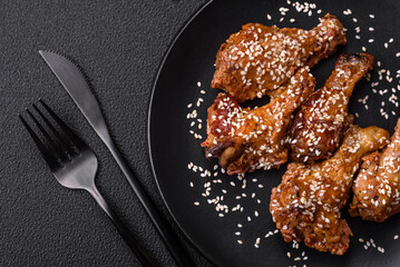 Delicious grilled chicken wings with salt, spices and teriyaki sauce