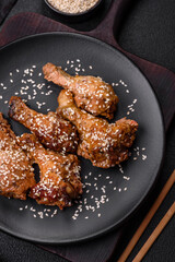 Delicious grilled chicken wings with salt, spices and teriyaki sauce