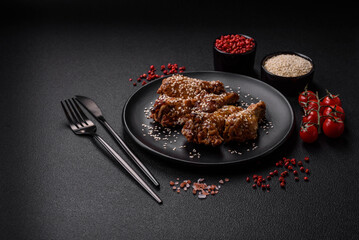 Delicious grilled chicken wings with salt, spices and teriyaki sauce