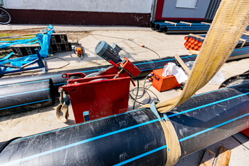 Equipment and device for butt welding polymeric HDPE water pipes