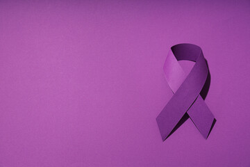 Purple ribbon, concept for the day of elimination of violence against women.
