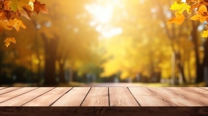 Naklejka na ściany i meble The empty wooden table top with blur background of autumn.