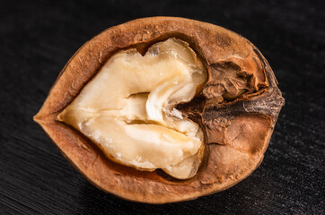 beautiful walnut, macro photo, close-up, on a black background