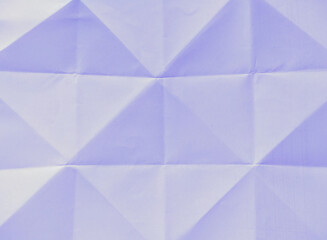 White paper folded into several triangles for design.
