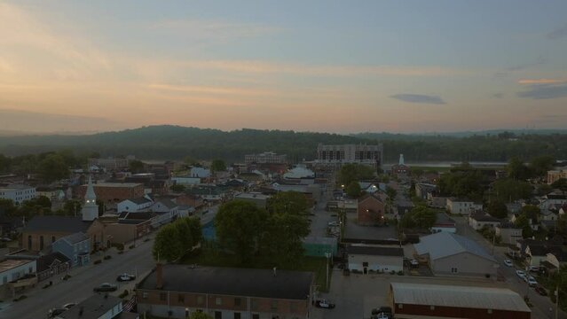 Aerial flyover main street in Lawrenceburg, Indiana on a beautiful morning at sunrise.