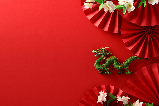 Dragon with Sakura and Folding Paper Fans on Red Background - Chinese New Year 2024 Celebration