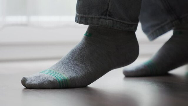 Close up of person's foot nervously shaking. Concept of nervous reflexes, OCD and mental health problems