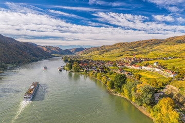 Autumn panorama of Wachau valley (Unesco world heritage site) with ships on Danube river near the...