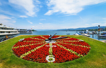 Lake Zurich in Switzerland. Flower clock on the waterfront of Lake Zurich. A walk through the city on a sunny day.