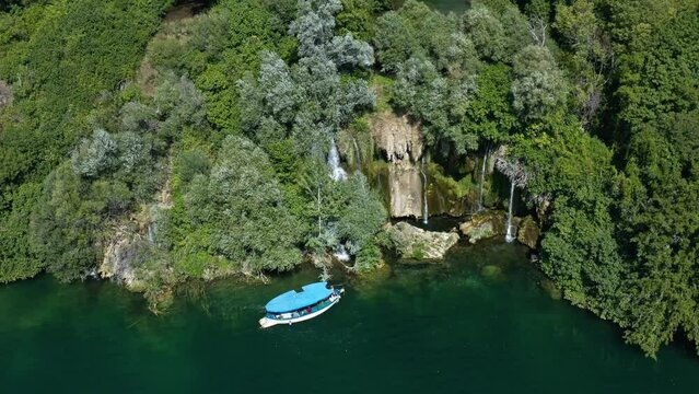 Tourist Cruise Boat Near Roski Slap Waterfall In Krka National Park, Croatia. Aerial Drone Shot