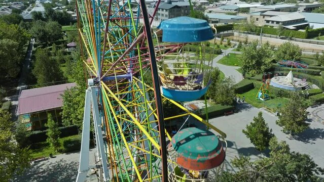 Rustic Ferris Wheel On Abandoned Amusement Park In Sayram Near Shymkent, Kazakhstan. Aerial Closeup