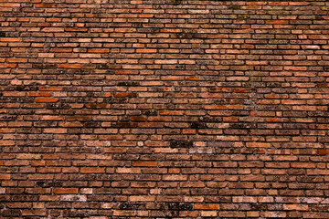 Photo of an old empty brick background for design. A red brick wall.