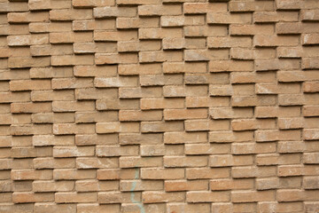 Photo of an old empty brick background for design. A red brick wall.