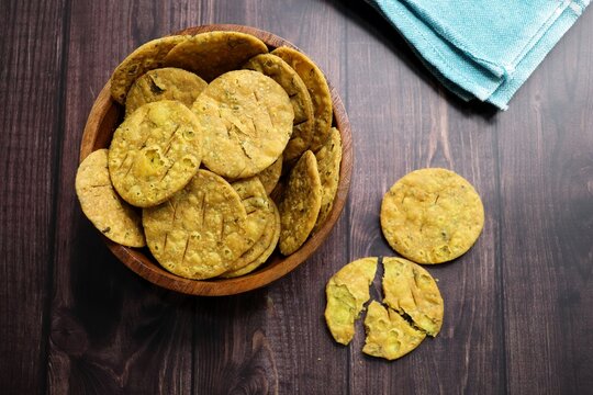 Crispy and crunchy methi mathri is a popular tea time snack in north India. It's especially popular during the Diwali festive season. It's a savory cracker or Masala puri. Copy Space.