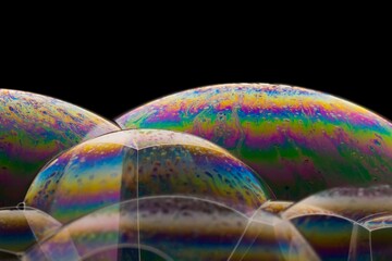 Macro shot of colorful soap bubbles on a dark background