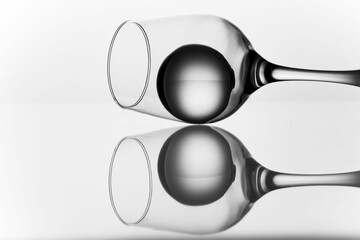 Ice ball inside a wine glass with reflection