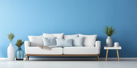 Foto op Canvas White modern upholstered cushioned sofa with blue wall art © Katrin_Primak