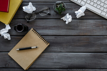Open notepad with keyboard and books. Writers author home office