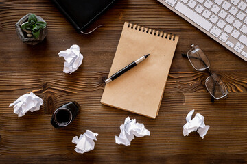 Open notepad with keyboard and books. Writers author home office