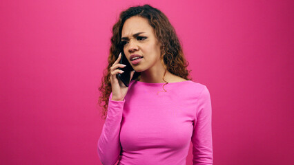 Young woman fighting on the phone, talking and getting upset, give attitude