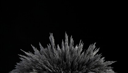 Reaction of iron dust to a magnetic field of a strong neodymium magnet on a black background