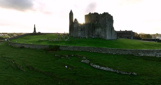 The sun is breaking through the old castle Cashel, 4k