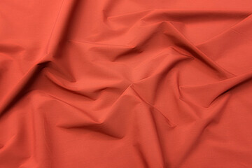 Abstract background texture of natural red color fabric. Fabric texture of natural cotton or linen,...