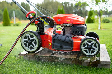 self-propelled lawn mower with hose connection for cleaning the deck