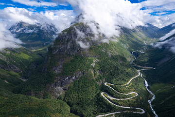 Aerial view from above the clouds  the valley of Videseter descending towards fjord in Norway