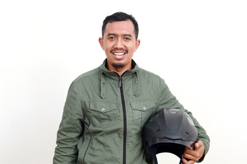 Happy asian man wearing jacket standing while holding helmet. Isolated on white background