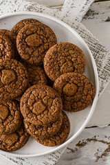 chocolate cookies on a white wooden background