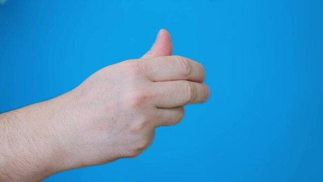 Hand gesture with finger on blue background. Forefinger