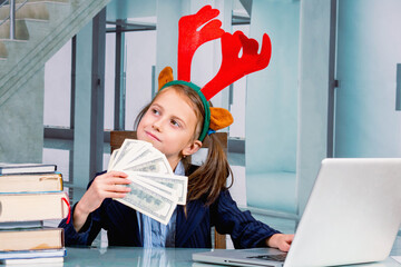 Make money online for beginners. Beautiful young girl with New Year's and Christmas reindeer...