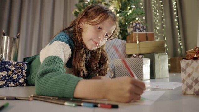  Small Cute Child Girl Laying on the Floor, Drawing letter to Santa Claus