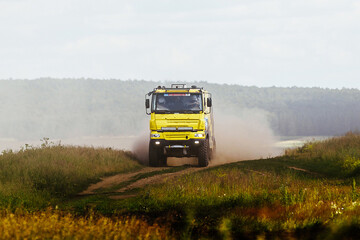 racing truck high speed moving on terrain road in cross country rally