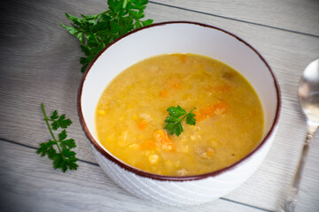 dried pea soup in a plate with herbs