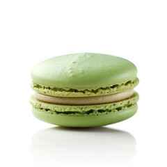 Pistachio green macaron perfectly shaped against
