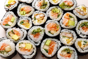 Top view of various sushi rolls.