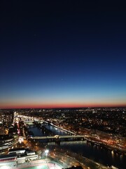 Fototapeta na wymiar View over the illuminated Paris during the nighttime