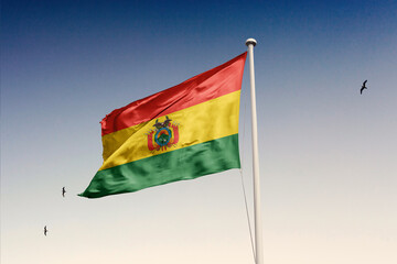 Bolivia flag fluttering in the wind on sky.