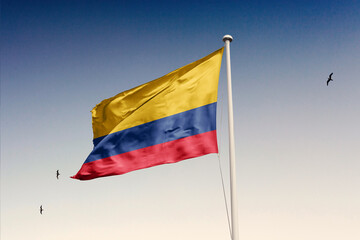 Colombia flag fluttering in the wind on sky.