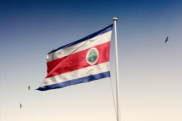 Costa Rica flag fluttering in the wind on sky.