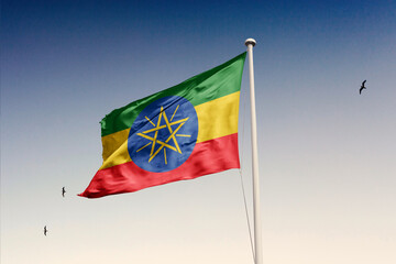 Ethiopia flag fluttering in the wind on sky.