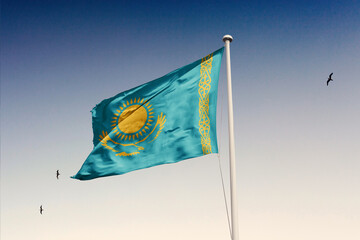 Kazakhstan flag fluttering in the wind on sky.
