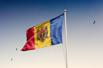 Moldova flag fluttering in the wind on sky.