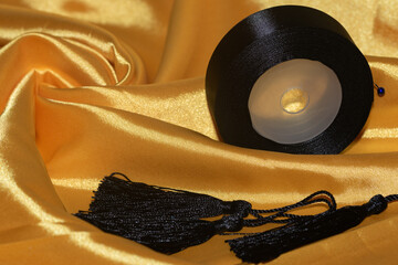 yellow silk fabric, with decorative tassels and silkribbon.