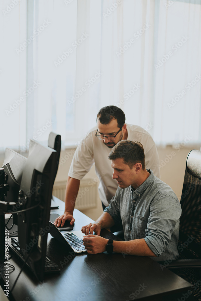 Wall mural portrait of two professional male programmers working on computer in diverse offices. modern it tech
