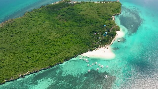 Top view of small island with beach and blue sea. Virgin Island, Philippines.