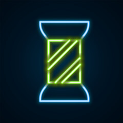 Glowing neon line Sewing thread on spool icon isolated on black background. Yarn spool. Thread bobbin. Colorful outline concept. Vector